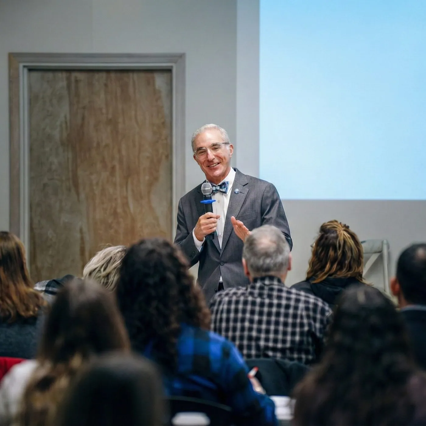 An orthobrain® educator speaking to a room of dental professionals